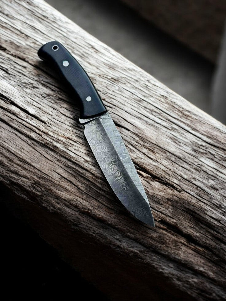 Damascus knife with black micarta handle