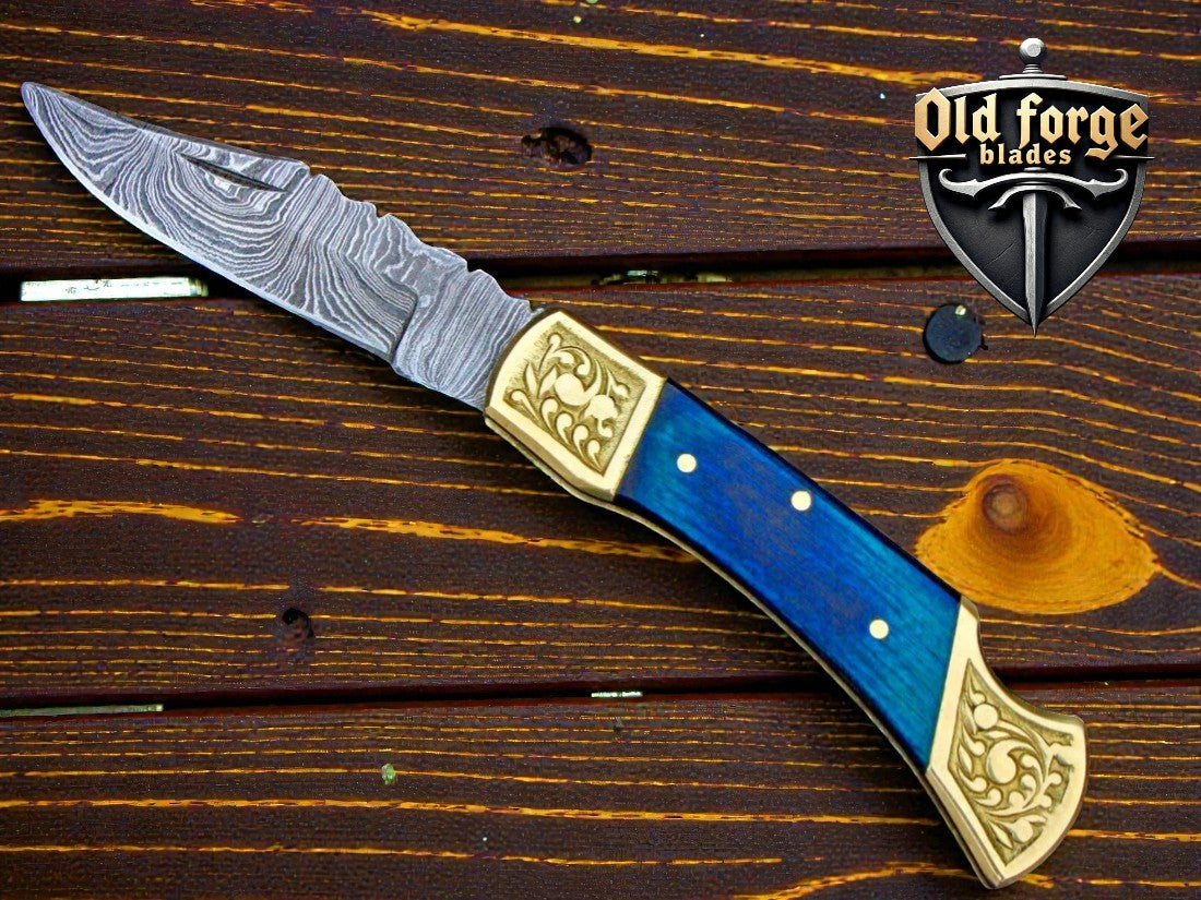 Handmade Damascus steel pocket knife with blue pakka wood handle and brass bolster