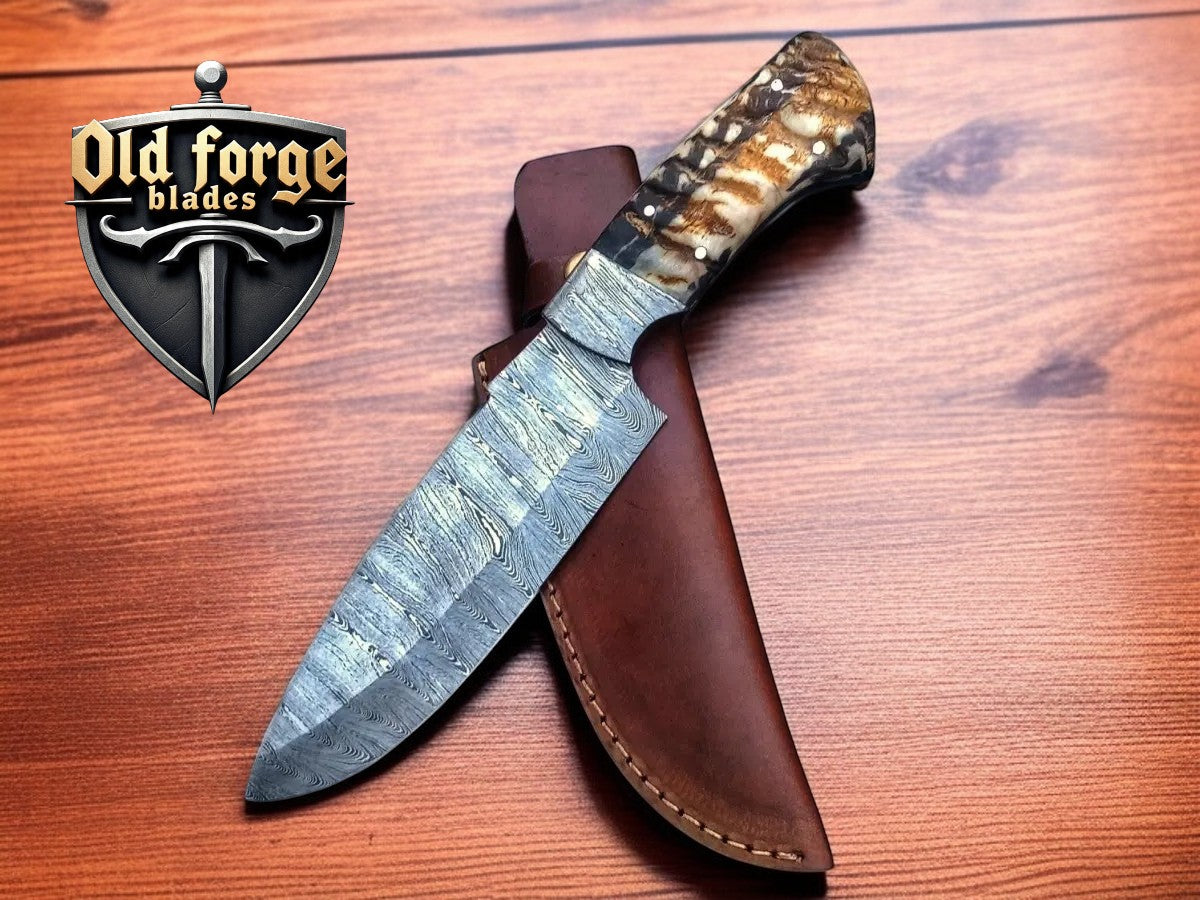 Custom Damascus steel hunting knife with resin handle and leather sheath