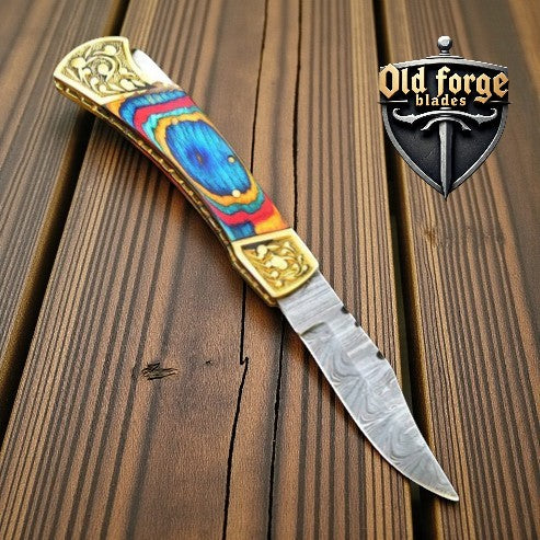 Handmade Damascus steel pocket knife with brass engraved bolster and multi Pakka wood handle