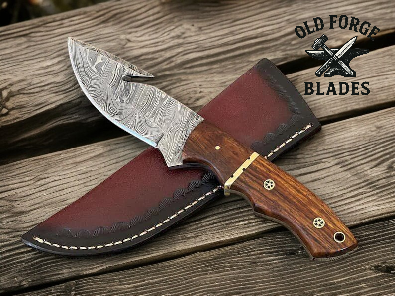 Custom handmade Damascus metal knife with gut hook and oiled rosewood handle