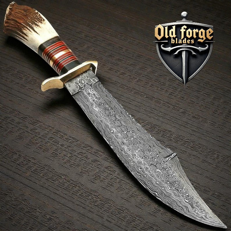 Handmade Damascus camp knife with stag bone handle and leather sheath