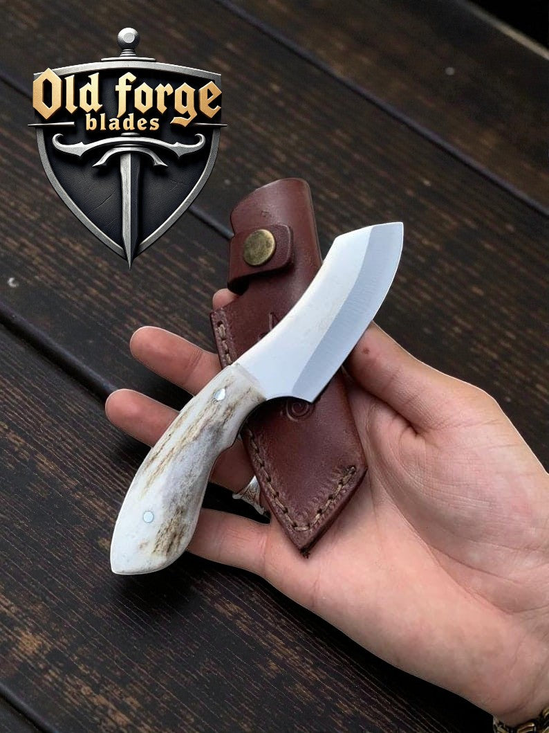 Handmade Damascus skinning knife with elk antler handle and leather sheath