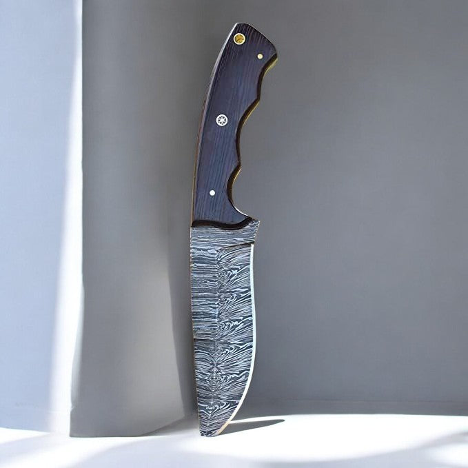 Damascus steel knife with dark wood handle and leather sheath