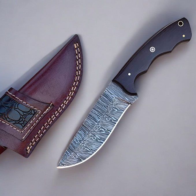 Close-up of 5-inch Damascus steel blade with intricate pattern