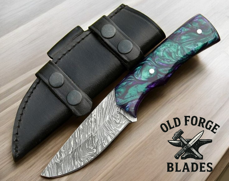 “Demascus knives with green and purple resin handle”