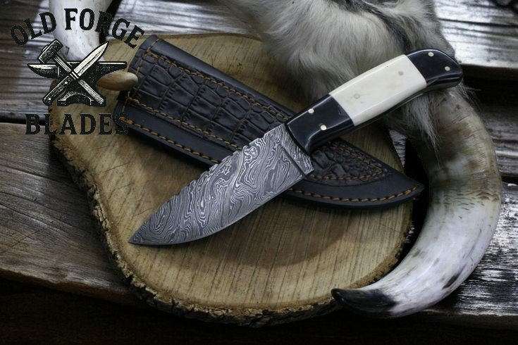 Handcrafted damacas knife with Damascus steel blade and white bone handle for hunting