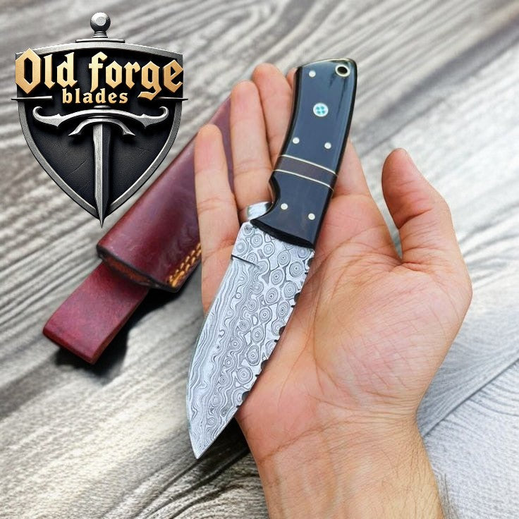 Custom handmade Damascus hunting knife with buffalo horn handle and leather sheath