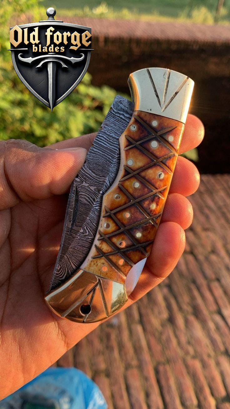 exclusive pocket knife damascus blade with brass bolster and sheath