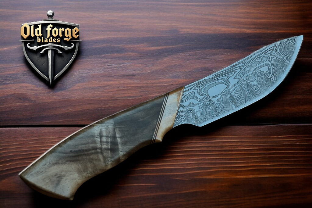Side view of Damascus blade hunting knife with ergonomic handle
