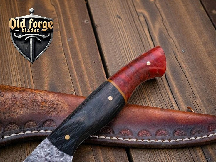 Knife with wooden handle and leather sheath on a wooden surface, 