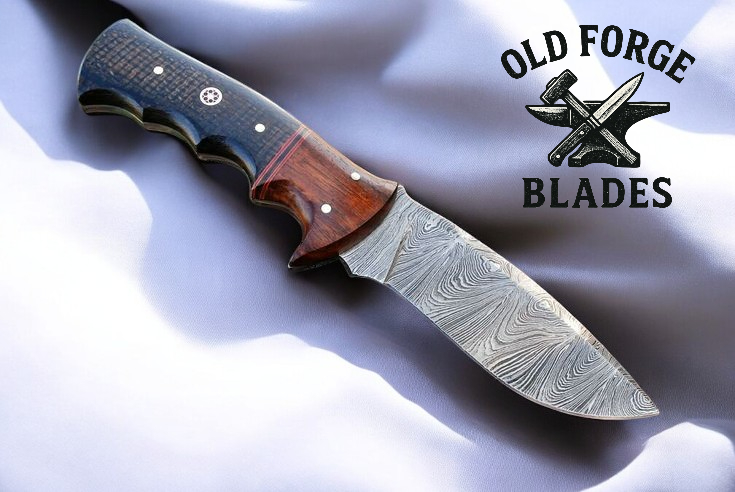 Watered steel blade hunting knife close-up pattern