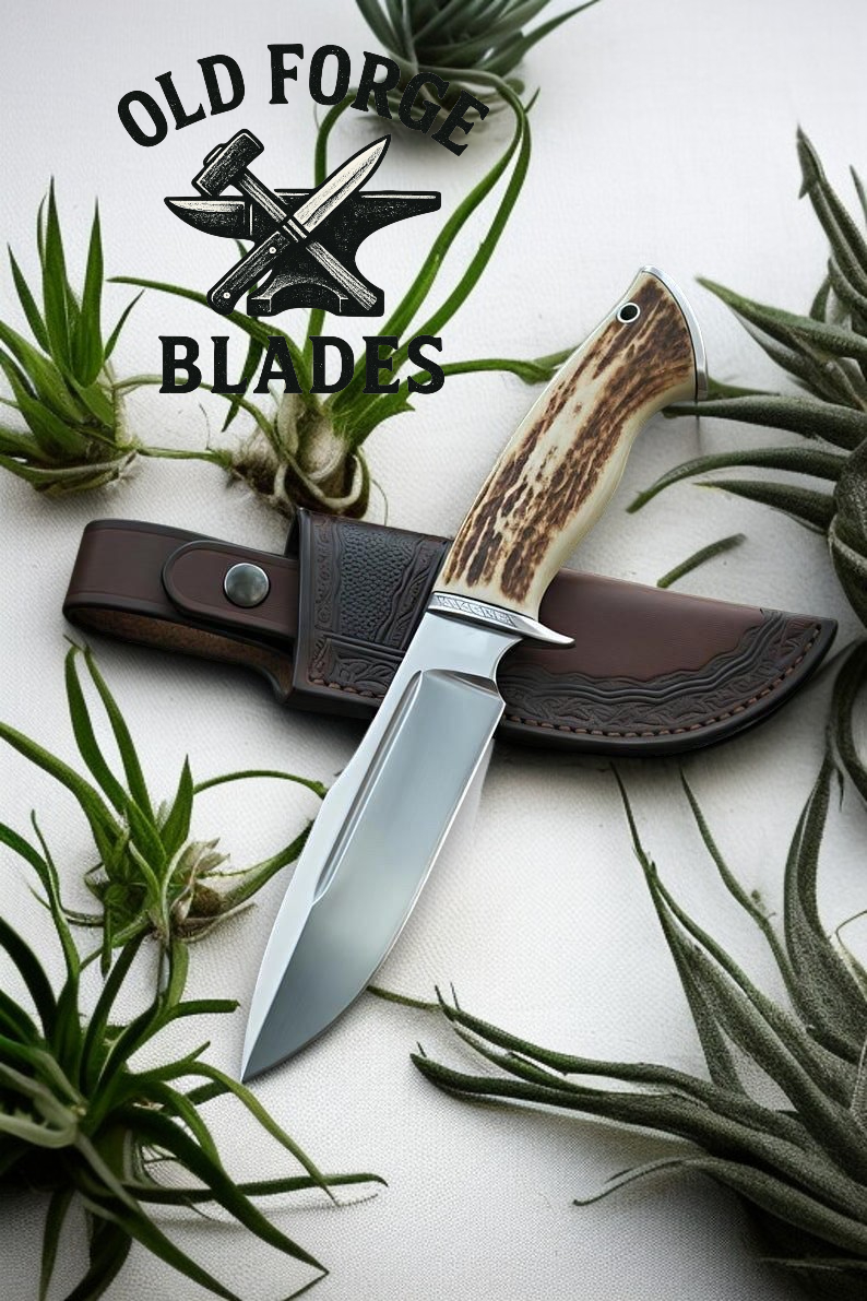 Hand-forged damascus steel knife blade with stag antler handle and drop-point design